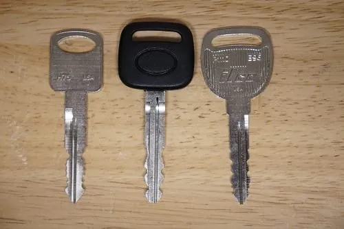 Three car keys lined up side by side