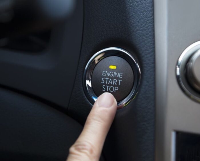 Automotive locksmith operating push-button ignition starter
